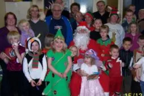 Paul Holmes and the Brimington Community Group with local children who enjoyed the party.