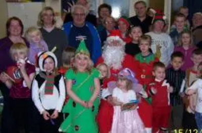 Paul Holmes and the Brimington Community Group with local children who enjoyed the party.